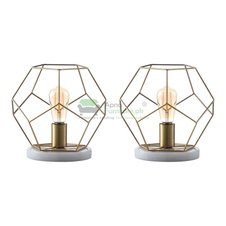Two geometric table lamps with marble bases on a white background,
