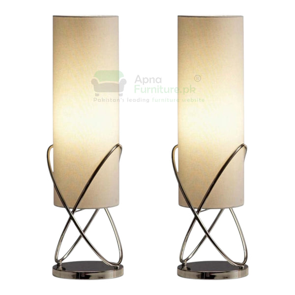 Two table lamps with beige lampshades and metal bases on a white background.