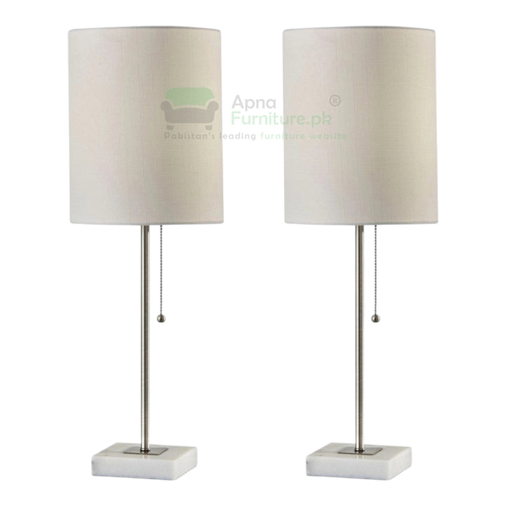Two table lamps with white lampshades and metal bases on a white background.