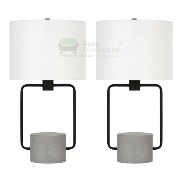 Two table lamps with white lampshades and concrete bases on a white background.