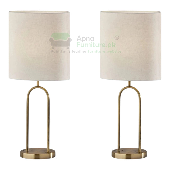 Two table lamps with beige lampshades and brass bases on a white background.