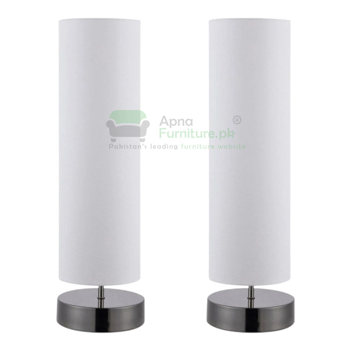 Two white table lamps with silver bases on a white background, branded 'Apna Furniture'.