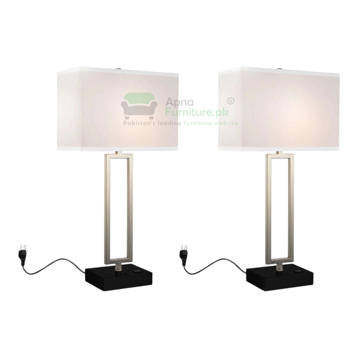Two table lamps with white shades and black bases on a white background, branded 'Apna Furniture'.