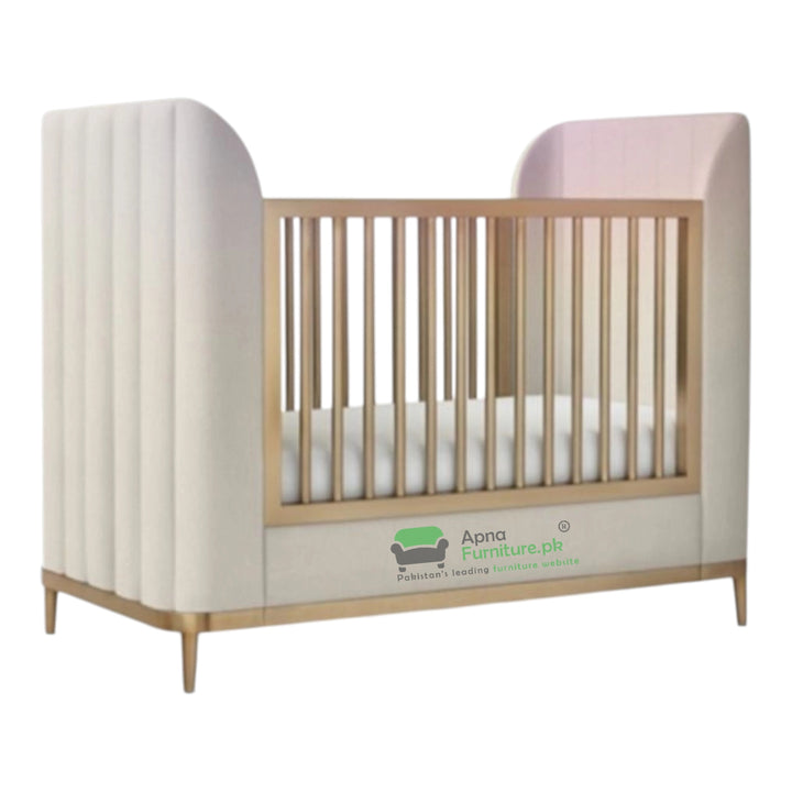 Baby crib with white mattress and pink headboard on a white background, featuring the Apna Furniture logo.