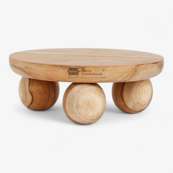 Wooden center table with a round top and cylindrical legs on a white background
