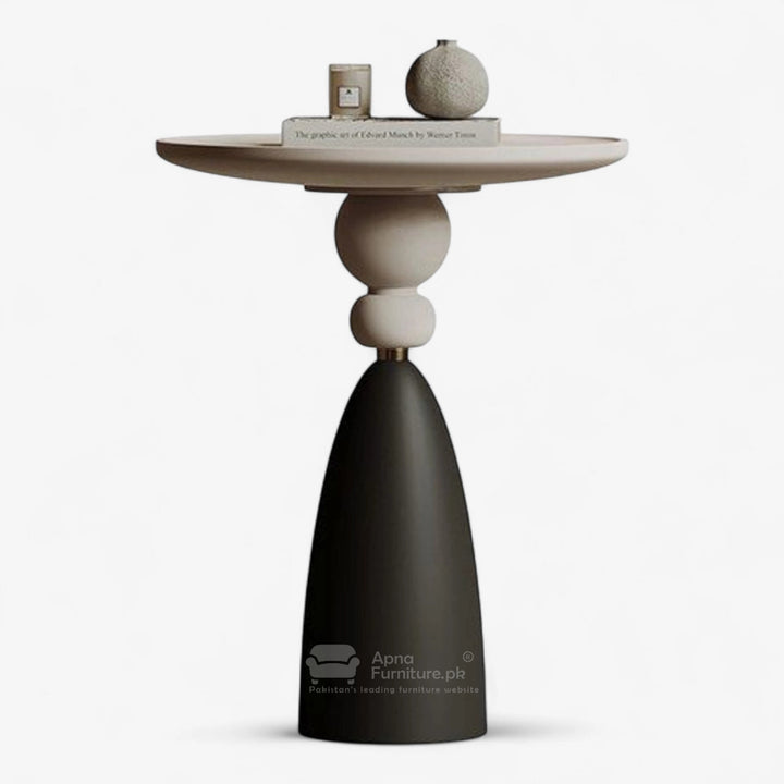 Modern side table with a black base and beige top on a white background