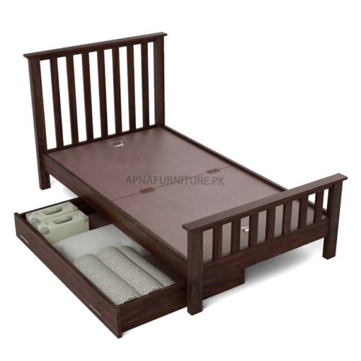 Single bed with wooden pillars on headboard and footboard