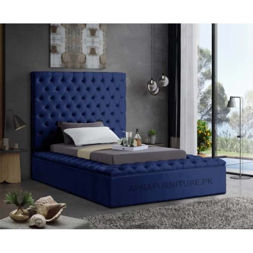single bed with velvet upholstery and storage boxes