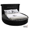 round double bed with tufting and storage options on three sides